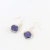 Flat lay view of blue diamond freshwater pearl earrings