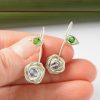 Cornflower Blue Swarovski Crystal Rose Drop Earrings showing hand scale
