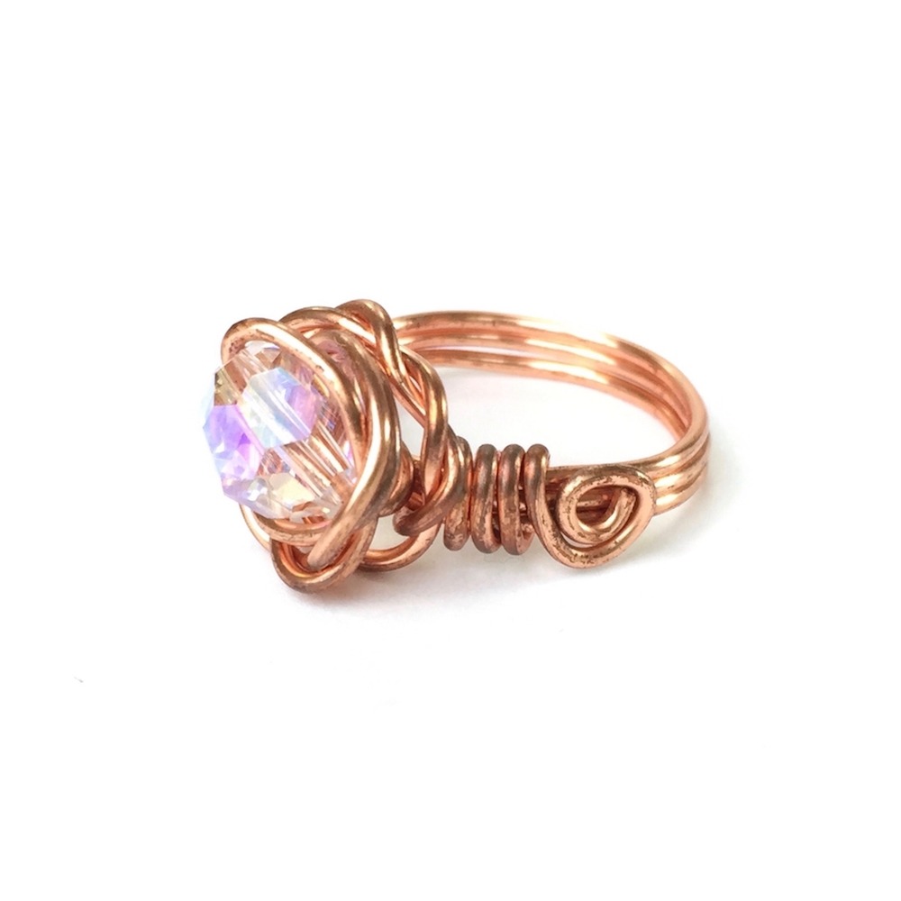 Side view showing Large Crystal Copper Wire Rose Ring on White Background