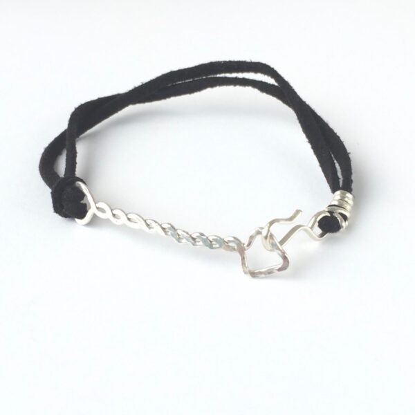 Twisted Arrow Unisex Bracelet with Black Suede Cord_Front Twisted Arrow Unisex Bracelet with Eco Silver Arrow and Black Suede Cord bracelet_From front on white background