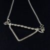 Twisted Arrow Chevron Necklace_Black background Angled Close Up