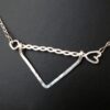 Twisted Arrow Chevron Necklace_Black background Close Up