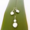 Diamond shaped ivory pearl earrings with geometric pearl pendant