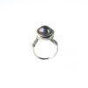 Cutout of wire wrapped black round pearl ring