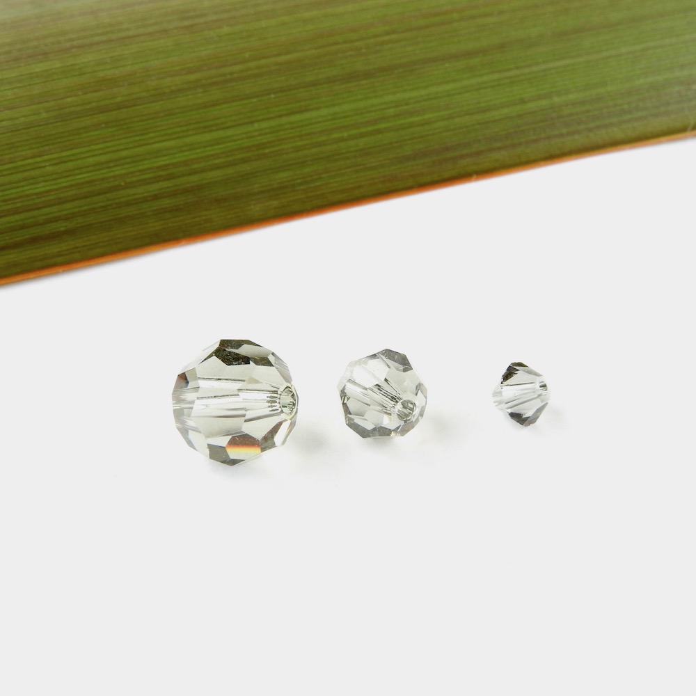 TransparentBlackSwarovskiCrystals.Bicone+6+8mm Translucent black Swarovski Crystals of different sizes