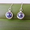 Close up view of black pearl drop earrings in eco Sterling Silver
