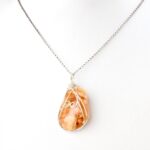 Clover Honey coloured NZ kauri resin silver double koru necklace