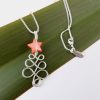 Curlicue NZ wire wrapped Christmas necklace with red pearl star