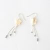Flatlay of Wishing Star Dangly Earrings in Eco Silver Flatlay of Wishing Star Dangly Earrings in Eco Silver