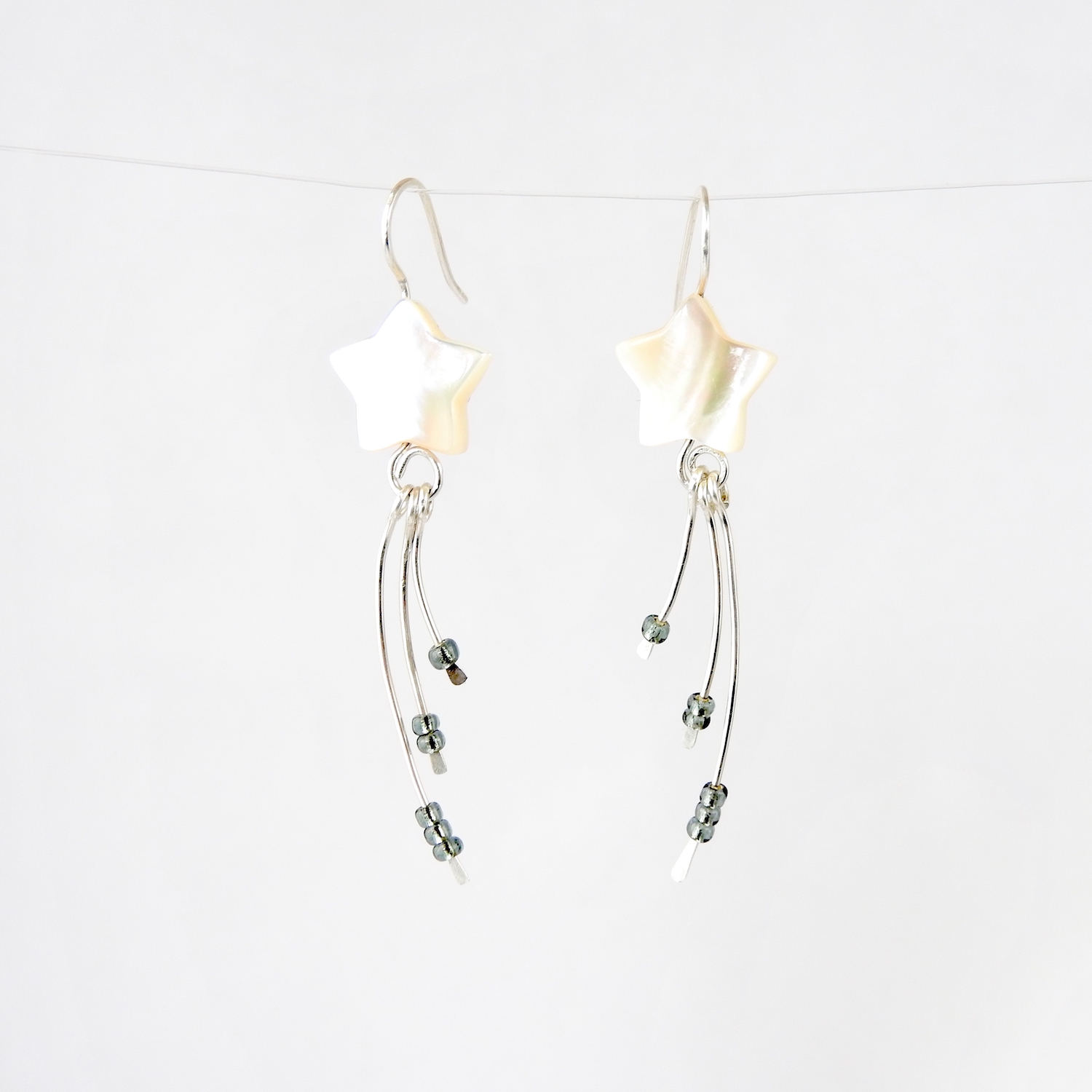 Wishing Star Eco Earrings against white background