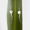 Wishing Star Earrings with Ivory Mother of Pearl Star and Eco Argentium Silver Wishing Star Earrings - like a shooting star - against flax background