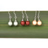 Trio Christmas Bauble Earrings_Square 3 different colours of Christmas Bauble earrings against flax_Main product image