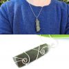 double photo showing closeup of NZ Greenstone wedge necklace and being worn