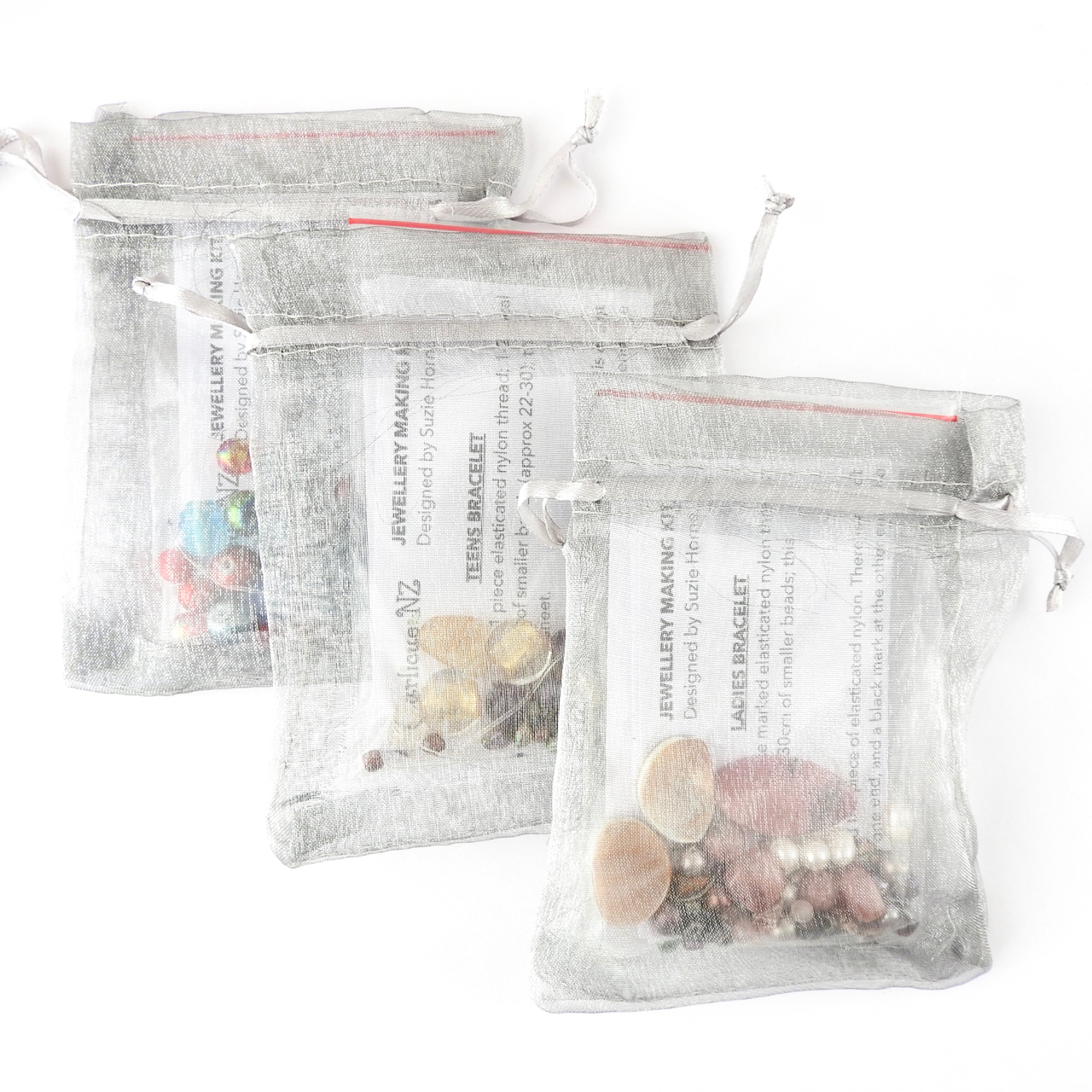 Bracelet Making Kits in their silver organza bags ready to go