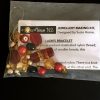 A selection of red and gold beads for this ladies bracelet kit