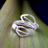 Ring_Bilateral Leaves in eco friendly Sterling Silver_Front on flax 2 Leaves adjustable ring handmade in recycled Sterling Silver