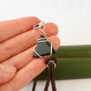 Hand scale of equilateral triangle greenstone and suede bracelet
