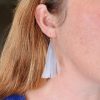 Long tassel earrings been worn on model_handcrafted from repurposed milk bottles
