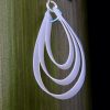 Three different sized strips of plastic milk bottle have been used to make these water droplet earrings