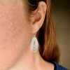 R3 water drop earrings with handmade eco Sterling Silver hooks worn by model