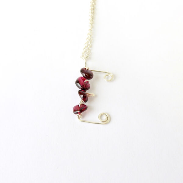 Kid sized capital letter E necklace with garnet semi precious stones
