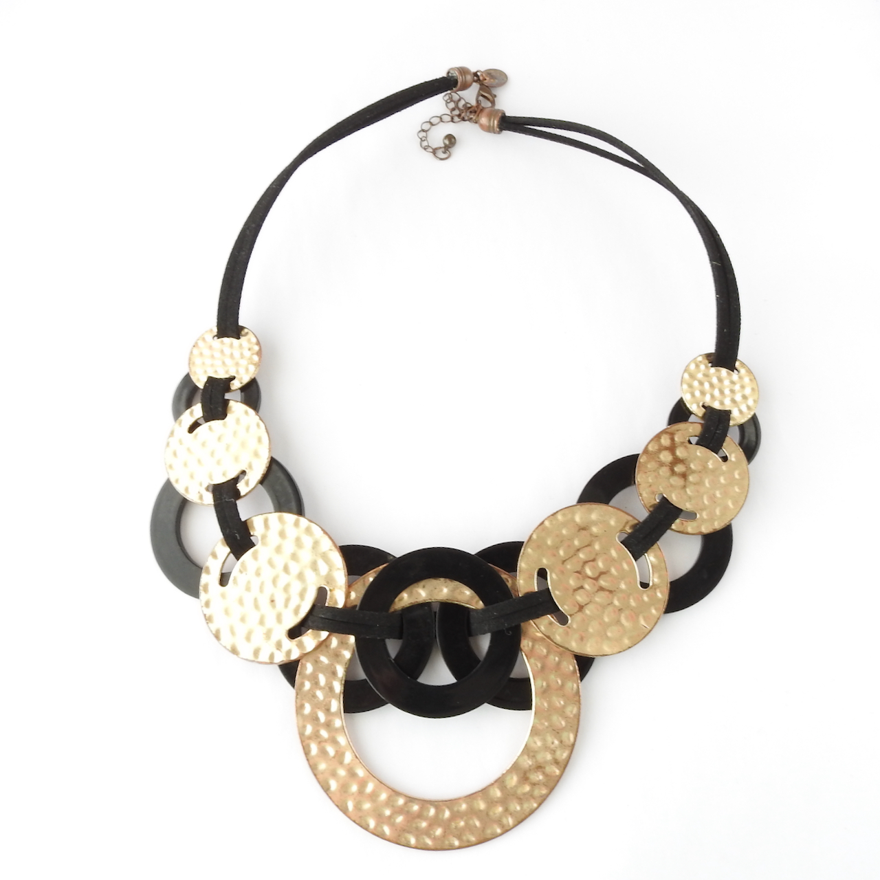 Back of black and gold circle necklace