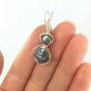 One round and one diamond shaped freshwater pearl forms this pendant