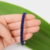 The braided or plaited back section of the square spiral mens bracelet_this one in blue suede cord