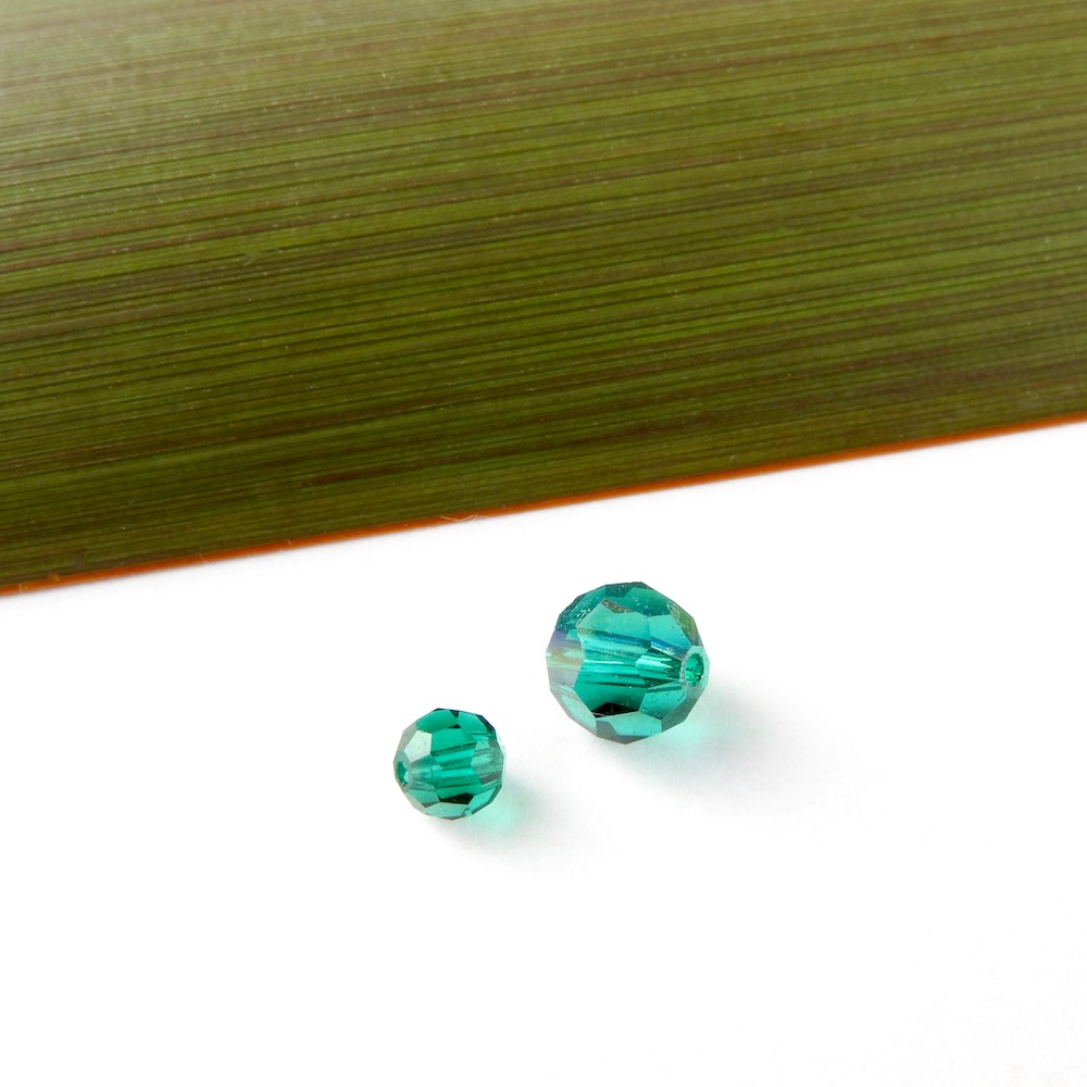 Emerald Green Swarovski Crystals that are 6mm and 3mm in size