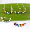 The Rainbow Smiles collection includes a bracelet, necklace, brooch and earrings