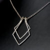 Front view of two diamond shapes ring holder necklace