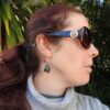 Model lifestyle shot showing Trapezium shaped NZ Greenstone earrings being worn