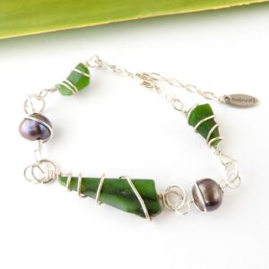 Three triangular pieces of NZ greenstone and 2 freshwater pearls spiral wrapped in sustainable silver-bracelet