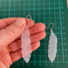 Small feather upcycled milk bottle earrings with recycled silver handmade hooks