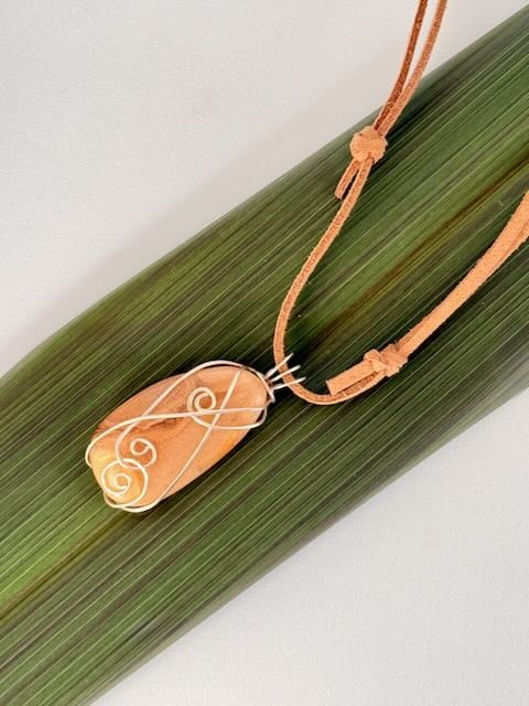 Kauri Gum necklace Close Up on Caramel suede adjustable cord_on flax