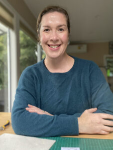 About Me - Suzie Horne, sitting at her jewellery desk in 2024